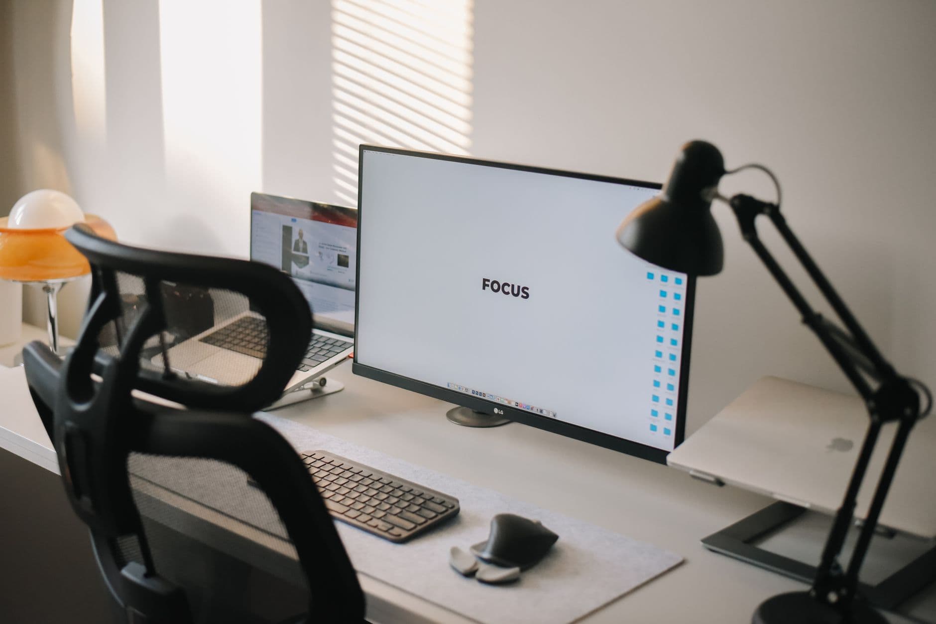 A clean and modern home office desk with a focus on productivity and technology.